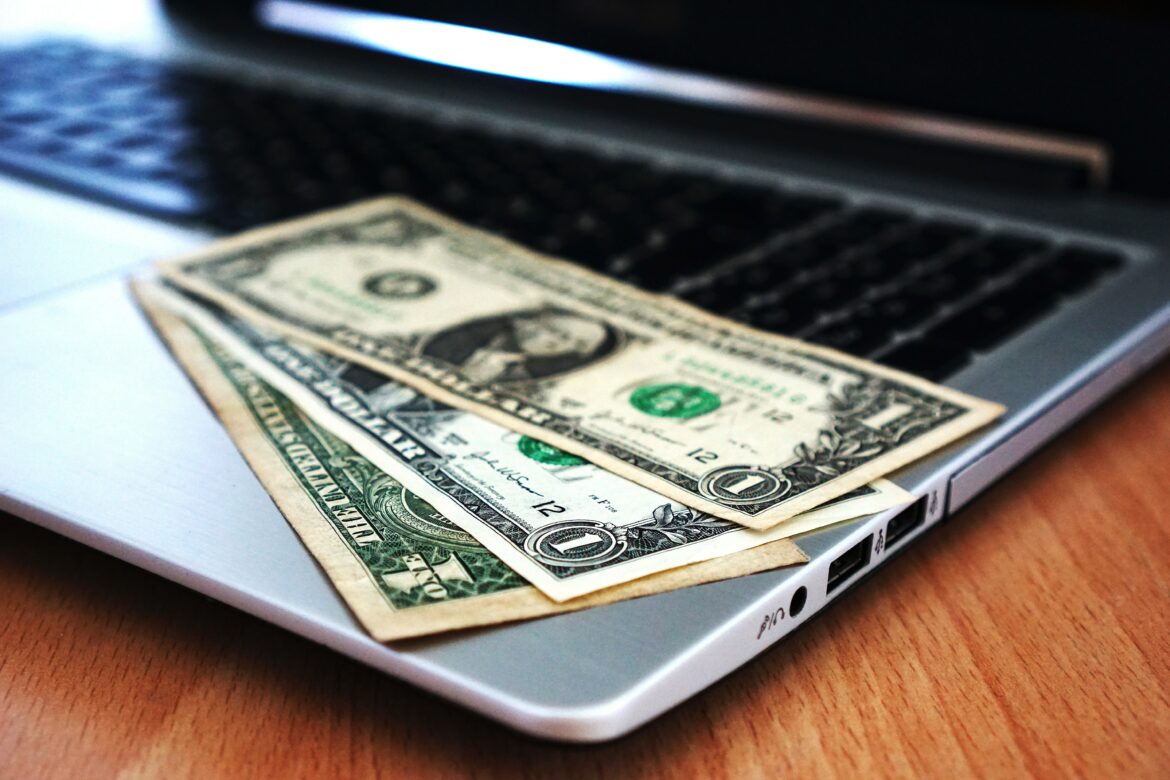 Dollars on a laptop. Source: Pixabay stock image