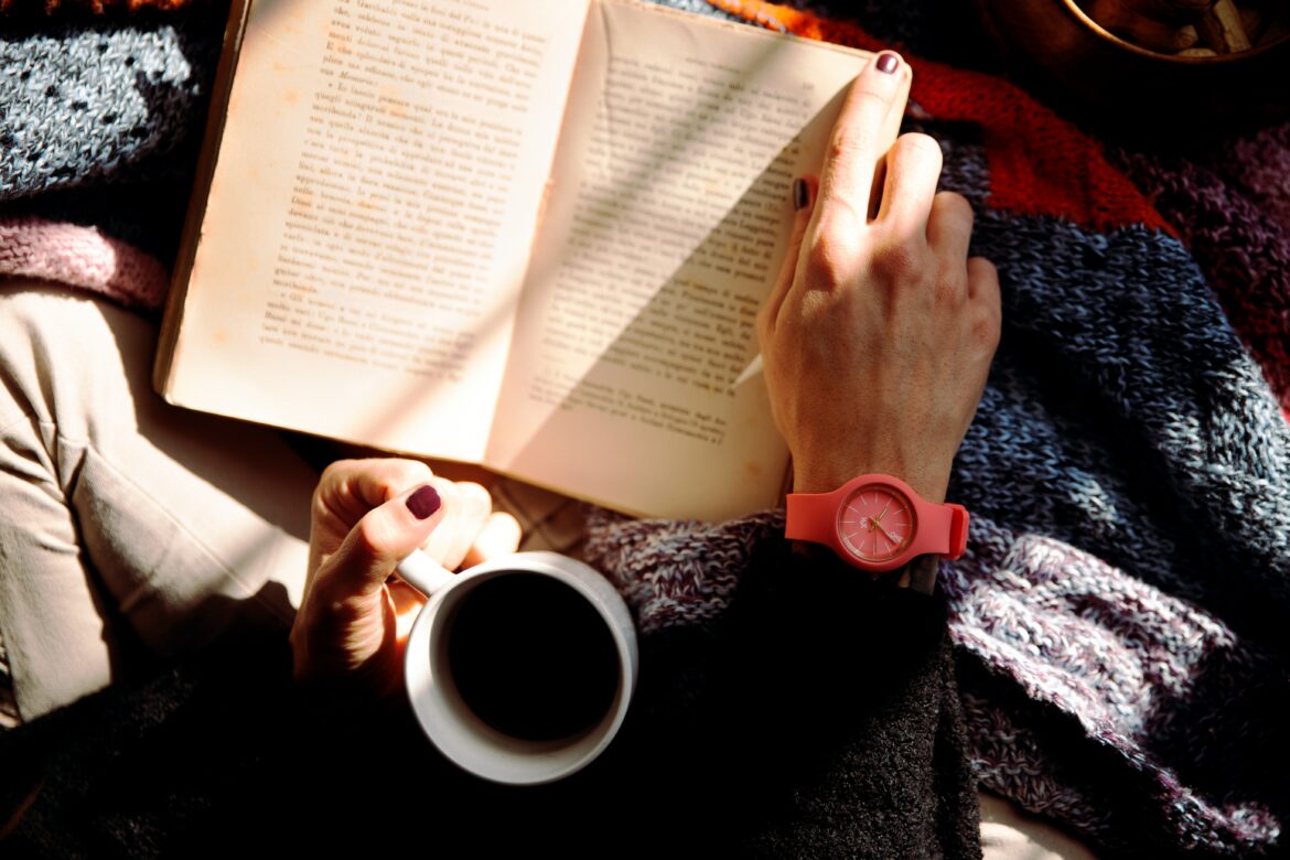 Reading a book in autumn. Source: Pexels