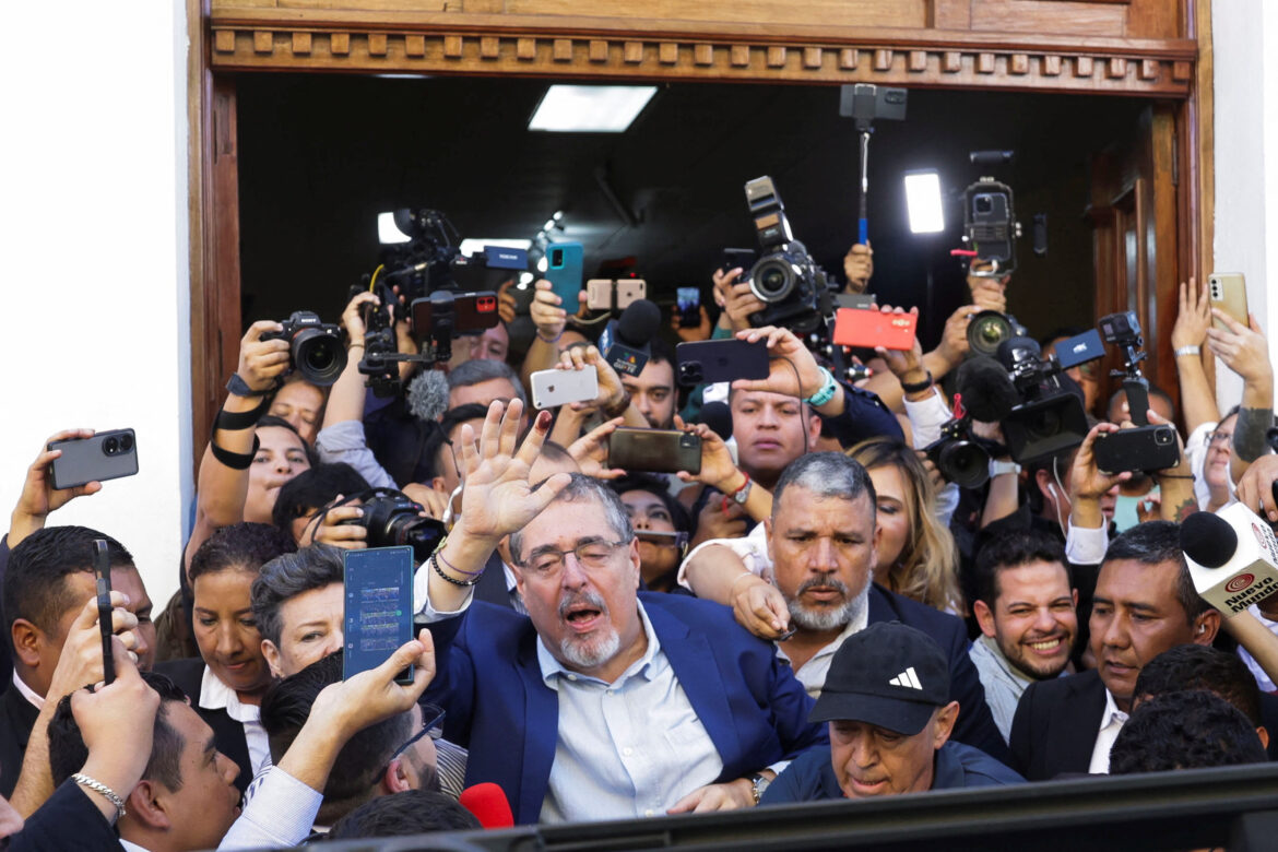 Guatemalan anti-graft presidential candidate Bernardo Arevalo, of the Semilla political party, waves next to media members during the presidential run-off election, in Guatemala City, Guatemala August 20, 2023. REUTERS/Pilar Olivares