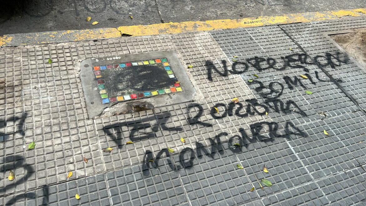 Sidewalk plaques commemorating the disappeared vandalized with messages in support of Javier Milei. Image: Abuelas de Plaza de Mayo