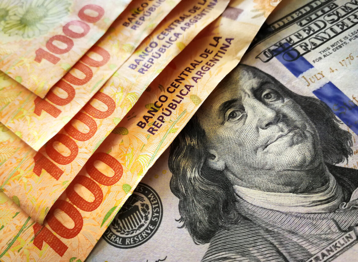 Argentine banknotes of 1000 pesos and american one hundred dollar bill