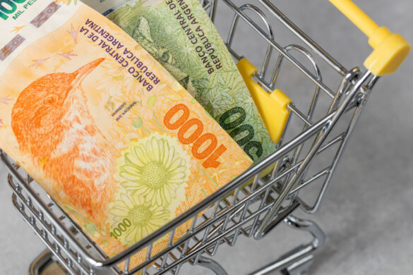 Financial concept, Argentina inflation rate, store prices, Empty shopping cart and Argentine pesos money
