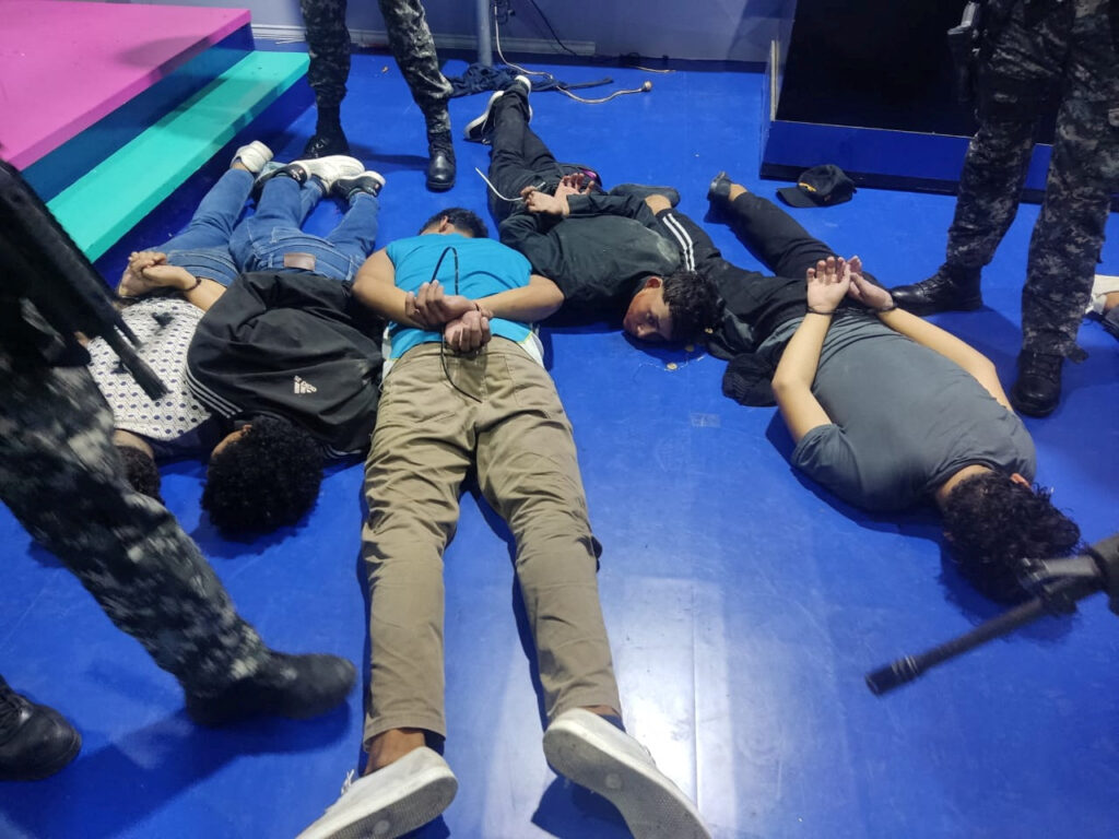 People accused of invading and taking over television station TC with weapons and forcing staff to lie and sit down, lie handcuffed on the floor in a police haundout, in Guayaquil, Ecuador, January 9, 2024. Ecuadorean Police/Handout via REUTERS