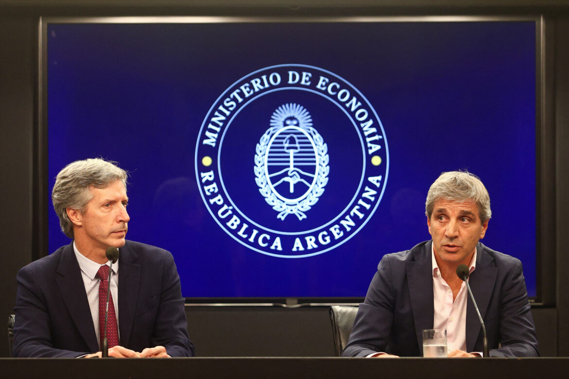 Argentina's Economy Minister Luis Caputo and Central Bank's President Santiago Bausili attend a press conference following a staff-level agreement with the International Monetary Fund (IMF) on the latest review of the country's $44 billion debt program, at the Economy Ministry building in Buenos Aires, Argentina, January 10, 2024. REUTERS/Matias Baglietto/File Photo