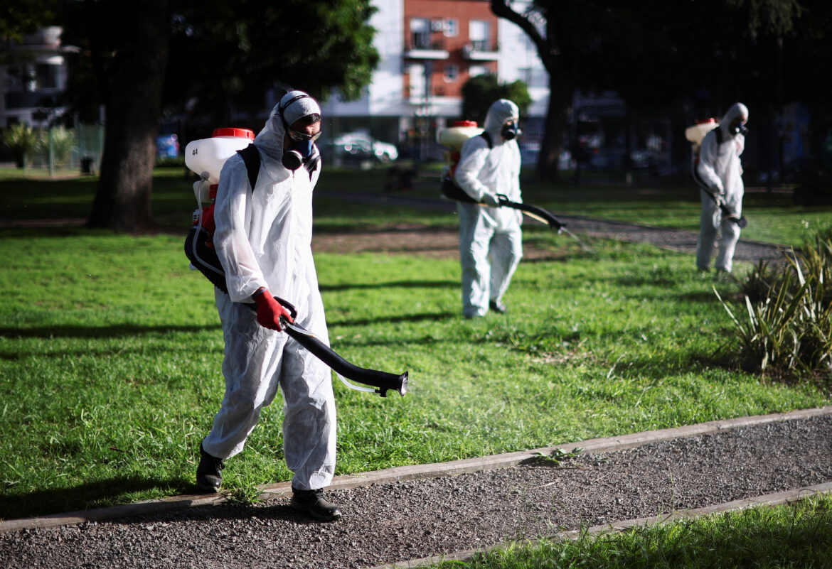 Health worker Javier Bellanzoni sprays insecticide to kill mosquitoes at a public park as dengue cases spike during a major outbreak, in Buenos Aires, Argentina March 26, 2024. REUTERS/Agustin Marcarian