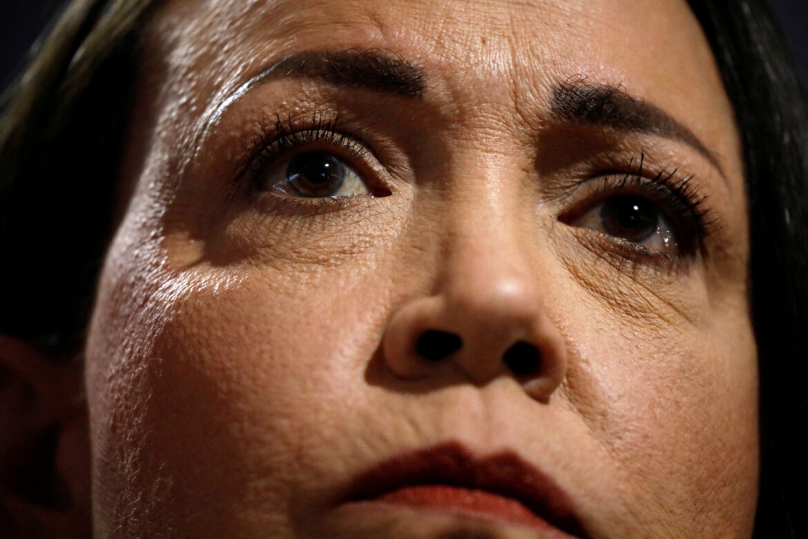 FILE PHOTO: Venezuelan opposition leader Maria Corina Machado looks on while addressing the media, in Caracas, Venezuela, March 20, 2024. REUTERS/Leonardo Fernandez Viloria/File Photo