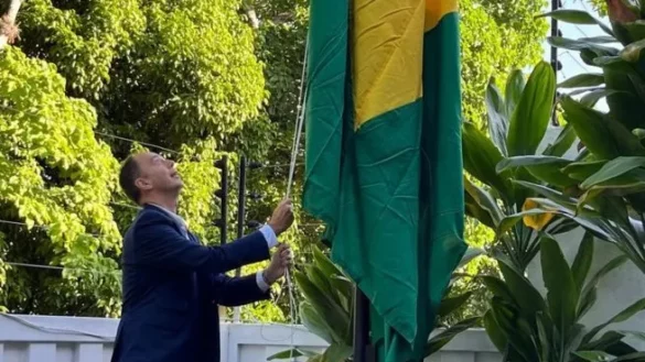 Brazilian flag is raised in the Argentine Embassy in Caracas.