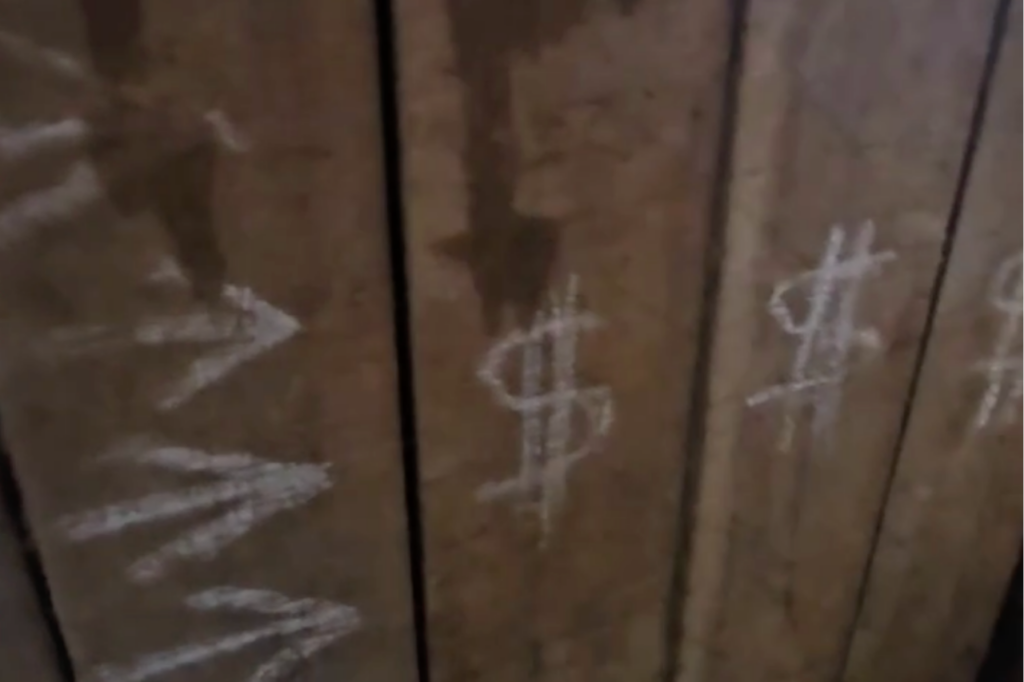 The perpetrators marked the panels with white arrows pointing toward the bank and several dollar signs.